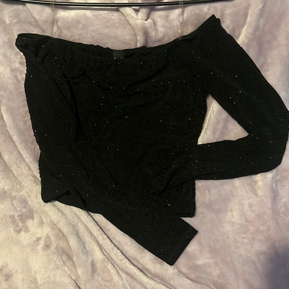 Mesh black off the shoulder crop top. Covered in black rhinestones.